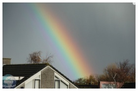 Regenboog met donkere band van Alexander