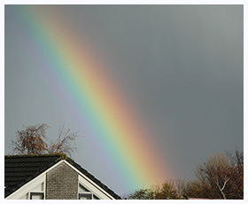 Regenboog met donkere band van Alexander